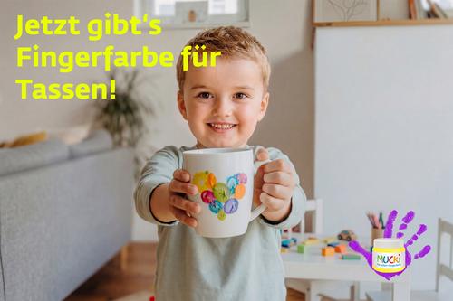 Junge mit bemalter Tasse